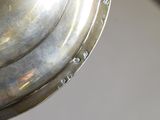 a close up of a metal object on a table