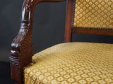 a chair with a yellow upholstered upholstered upholstered upholstered upholstered upholstered upholstered