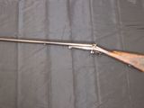the rifle is laying on the table ready to be used