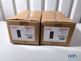 two boxes of new and unused lenky laptop computers are sitting on a table