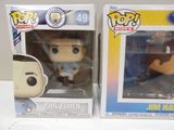 funko pop vinyl figures of a man in a blue shirt and a man in a blue shirt