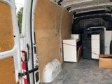 a white van with a bunch of boxes in the back