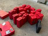 a lot of red plastic containers sitting on the ground