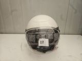 a helmet on a table with a price tag on it