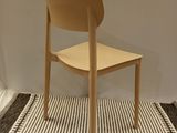 a chair that is sitting on a rug in a room