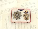 a small box with a medal and a star on it