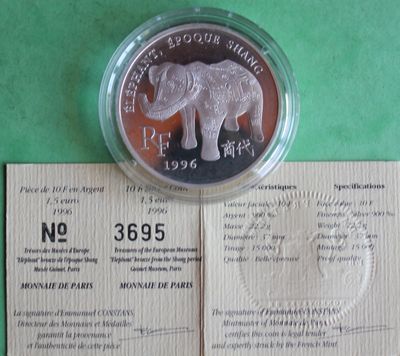 a silver coin with a picture of an elephant on it
