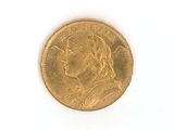 l'image d'une pièce d'or sur laquelle figure le visage d'une femme