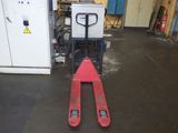 a fork lifter that is sitting in the middle of the floor