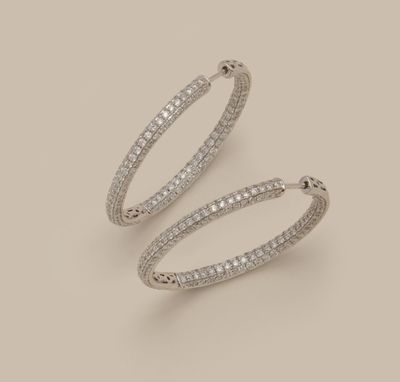 a pair of diamond hoop earrings
