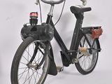 a black bicycle with a red light on it