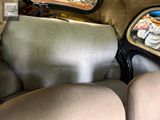a view of the inside of a car from the driver ' s seat