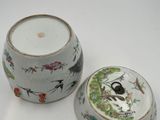 a white bowl with a skull on it and a small bowl with a skull on it