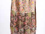 a multicolored skirt with fringes hanging on a hanger