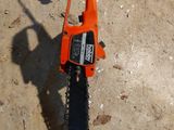 a chainsaw that is laying on the ground