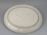 a white plate with a hole in the middle of it