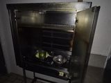 a small oven that has some food inside of it