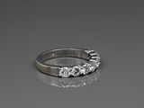 an image of a diamond ring on a reflective surface