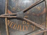a close up of a clock with a rope around it