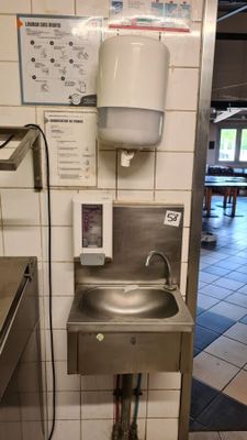 an image of a kitchen with a sink and a faucet