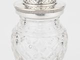 un bocal en verre ancien plaqué argent, surmonté d'un coq