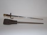 an old pair of swords on a white surface with a white background