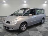 a picture of a silver minivan parked in a showroom