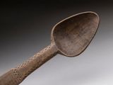 a wooden spoon with a wooden handle on a table