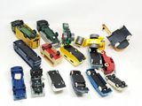 many different types of toy trains on a white surface
