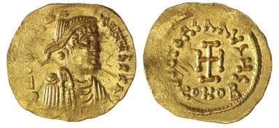 une pièce d'or à l'effigie d'une femme