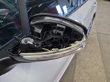 a close up of a car door handle with a mirror on it