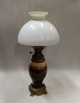 pair of antique lamps with white and brown glass shades