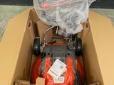 a box with a lawn mower inside of it