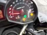 a close up of a speedometer on a motorcycle