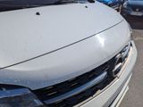 a white car that is parked in a parking lot