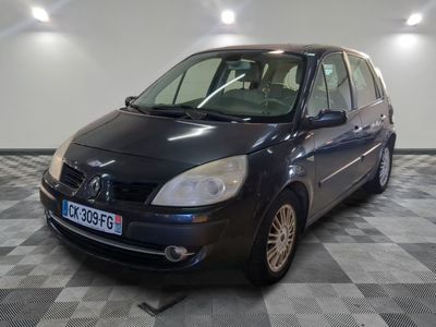 a picture of a small black car parked in a garage