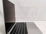 a laptop computer sitting on top of a white table
