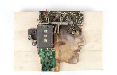 a picture of a man ' s head made out of electronic components