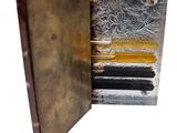 a metal box that has a bunch of papers inside of it
