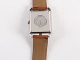 a watch that is sitting on top of a white surface