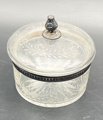 an antique silver plated box with a lid and a bird on top