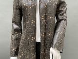 an image of a mannequin wearing a jacket and tie