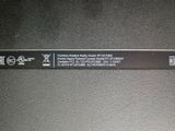 a close up of a label on the back of a laptop