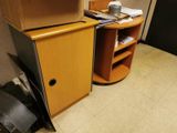 a microwave sitting on top of a cabinet in a room