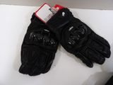 pair of black motorcycle gloves on a white surface with a red tag