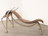 a wooden bench that is sitting in the middle of a room