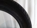a close up of a tire on a white surface