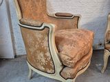 pair of antique french style chairs with upholstered cushions