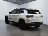 the jeep compass is parked in the garage of a dealers showroom