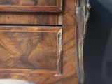 a close up of a wooden desk with a drawer on it